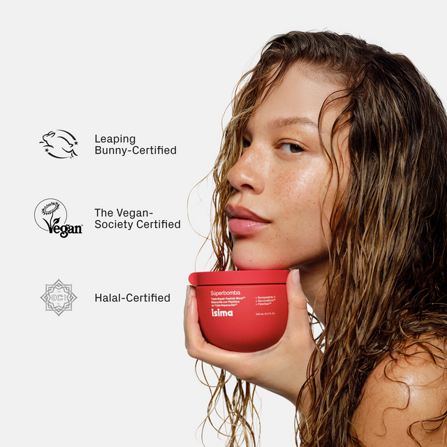 A woman with wet, wavy, healthy-looking hair holds a red container of isima Shakira's Starter Trio — Strength & Repair ($67 Value). Leaping Bunny, Vegan Society, and Halal certification logos appear beside her on a light background.